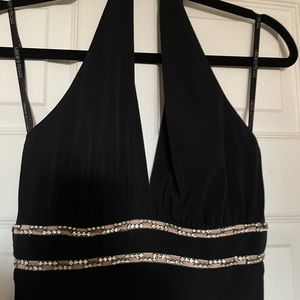 Sophisticated Black evening gown with a split on the side.